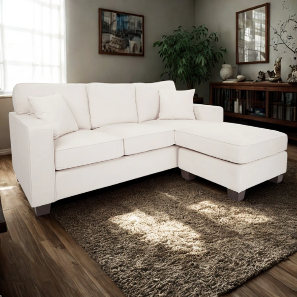Ivory upholstered sectional sofa with reversible chaise, square arms, cushion back, and coffee-finished wood block legs