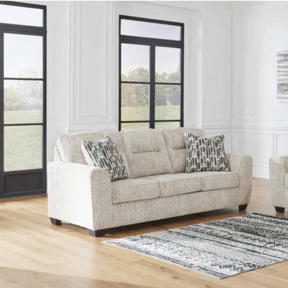 Light beige 3-seater sofa with plush cushions, accent pillows, and dark tri-block legs, ideal for modern living rooms.