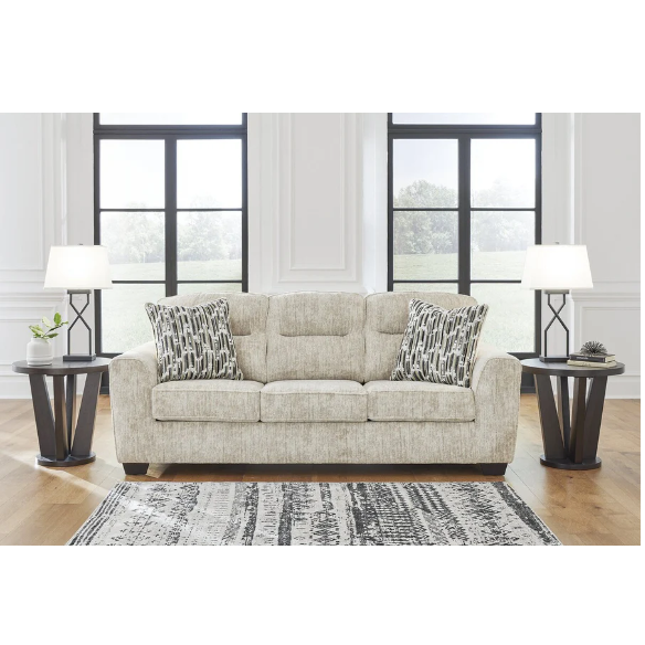 Light beige 3-seater sofa with plush cushions, accent pillows, and dark tri-block legs, ideal for modern living rooms.