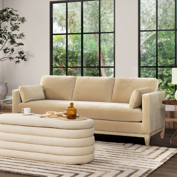 Light camel velvet 3-seater sofa with feather-down cushions, track arms, and solid wood legs, ideal for modern and transitional spaces.