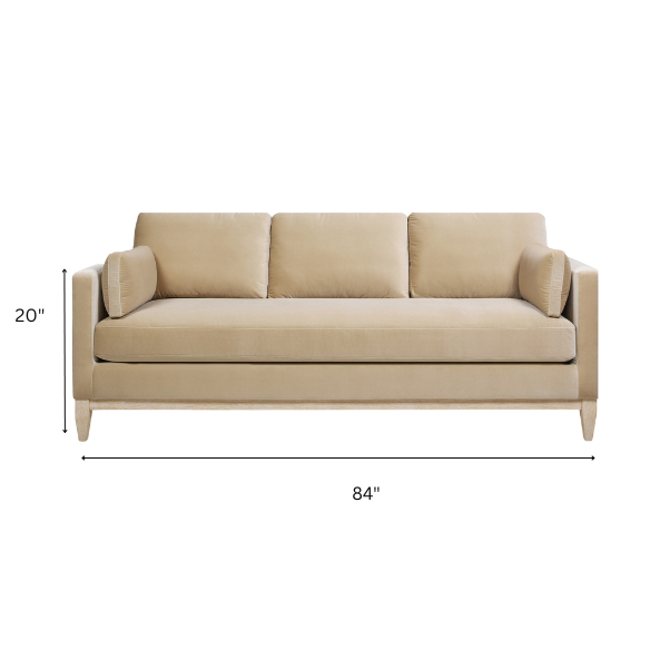 Light camel velvet 3-seater sofa with feather-down cushions, track arms, and solid wood legs, ideal for modern and transitional spaces.