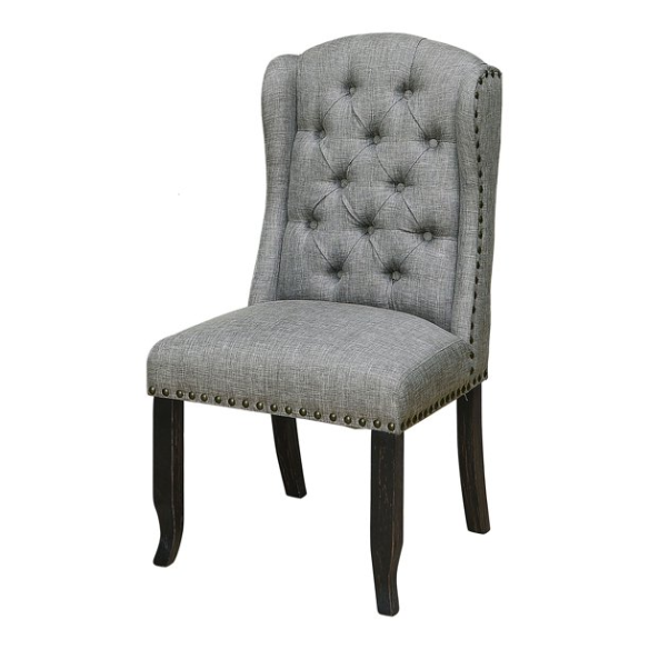 Set of two light grey farmhouse-style wingback dining chairs with button tufting, nailhead trim, and antique black tapered legs