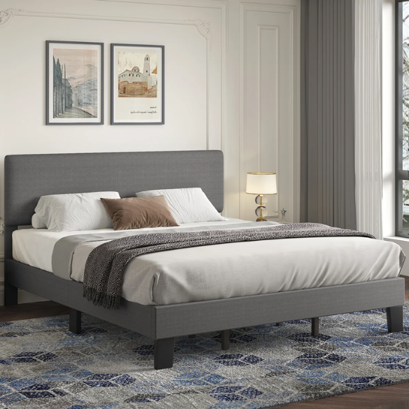 Light grey upholstered king-size platform bed with adjustable headboard, foam padding, and underbed storage clearance for modern bedrooms