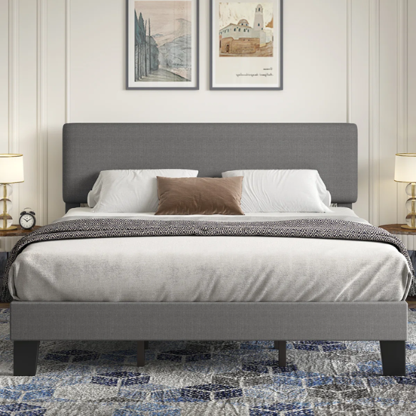 Light grey upholstered king-size platform bed with adjustable headboard, foam padding, and underbed storage clearance for modern bedrooms