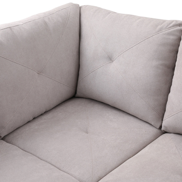 Light grey L-shaped sectional sofa with right-facing chaise and ottoman, microfiber upholstery and light gray wooden legs