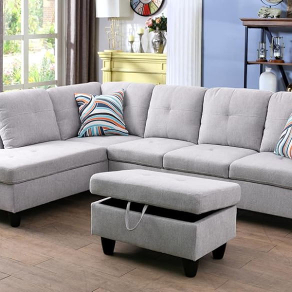 Light grey L-shaped sectional sofa with right-facing chaise and ottoman, microfiber upholstery and light gray wooden legs
