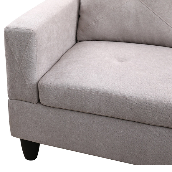 Light grey L-shaped sectional sofa with right-facing chaise and ottoman, microfiber upholstery and light gray wooden legs