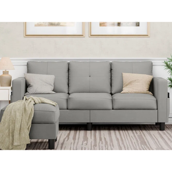 Compact light grey L-shaped sectional sofa with storage ottoman, firm cushions, and stain-resistant fabric, perfect for small spaces.