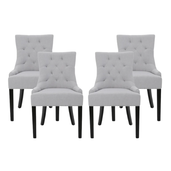 Set of four light grey upholstered dining chairs with diamond tufted backs, armless design, sloped armrests, and espresso brown wood legs.