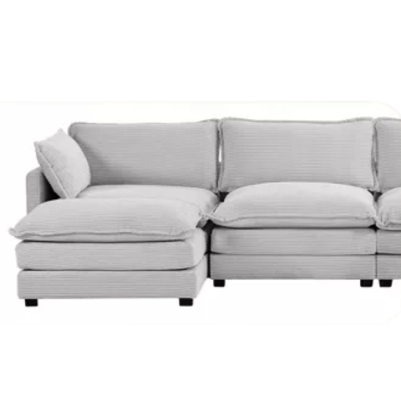 Light grey modular three-seater corduroy sectional sofa with movable ottoman, modern L-shaped couch for living room with soft cushions and sturdy wood-metal frame.
