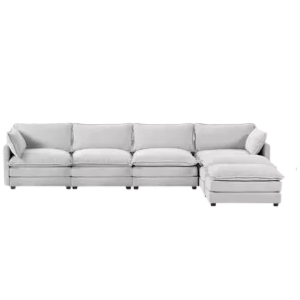 Light grey modular 4-seat sectional sofa with two matching ottomans, upholstered in soft corduroy fabric with high-resilience cushions and a durable wood and metal frame.