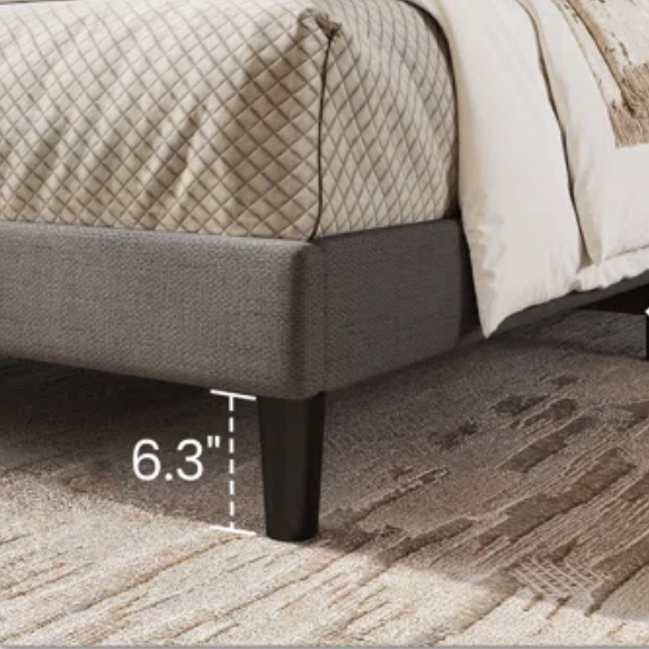 Light grey linen upholstered queen platform bed with wingback headboard, tapered black legs, and slatted support – no box spring needed