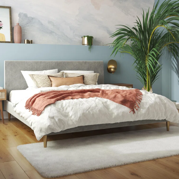 Light grey velvet king-size platform bed with upholstered headboard and wood slats, modern design, no box spring required.