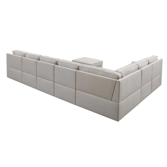 Spacious light taupe U-shaped sectional sofa with reversible configuration, removable cushions, nailhead trim, and matching ottoman—seats up to 8.