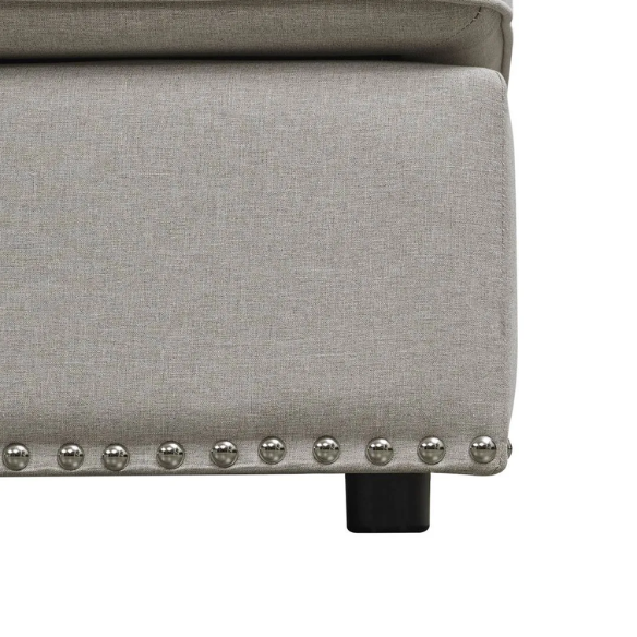 Spacious light taupe U-shaped sectional sofa with reversible configuration, removable cushions, nailhead trim, and matching ottoman—seats up to 8.