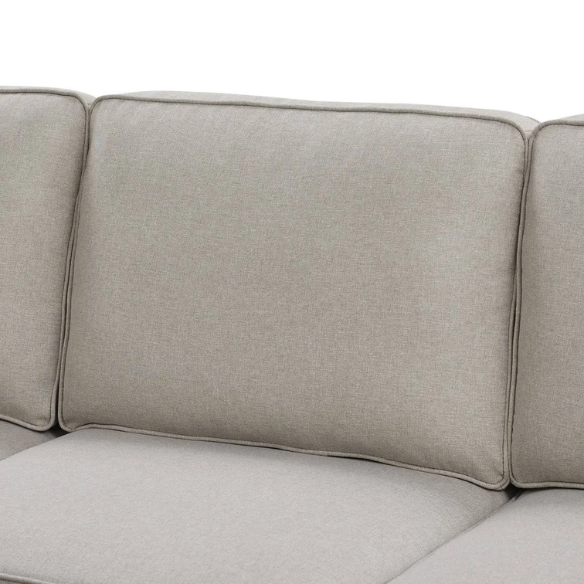 Spacious light taupe U-shaped sectional sofa with reversible configuration, removable cushions, nailhead trim, and matching ottoman—seats up to 8.