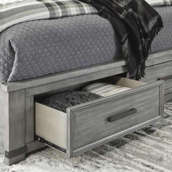 King-size storage bed in light weathered gray finish with tall panel headboard, footboard drawers, and dark bronze hardware accents