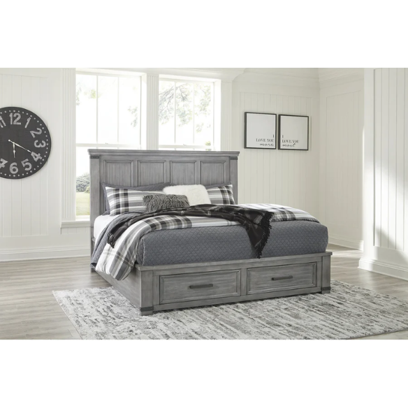 King-size storage bed in light weathered gray finish with tall panel headboard, footboard drawers, and dark bronze hardware accents