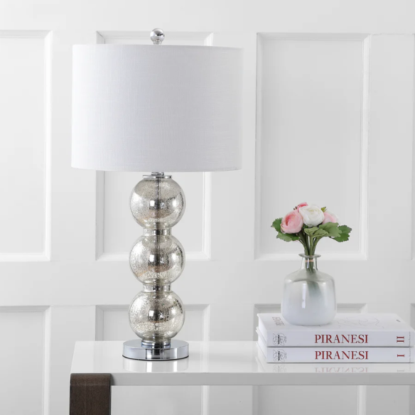 Set of 2 mercury glass table lamps with triple-sphere design, polished silver accents, and white linen drum shade – elegant lighting for modern or glam interiors