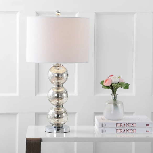 Set of 2 mercury glass table lamps with triple-sphere design, polished silver accents, and white linen drum shade – elegant lighting for modern or glam interiors