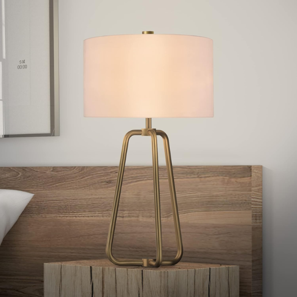 Mid-century modern brass table lamp with a white drum fabric shade and rotary switch, ideal for living rooms, bedrooms, or office desks