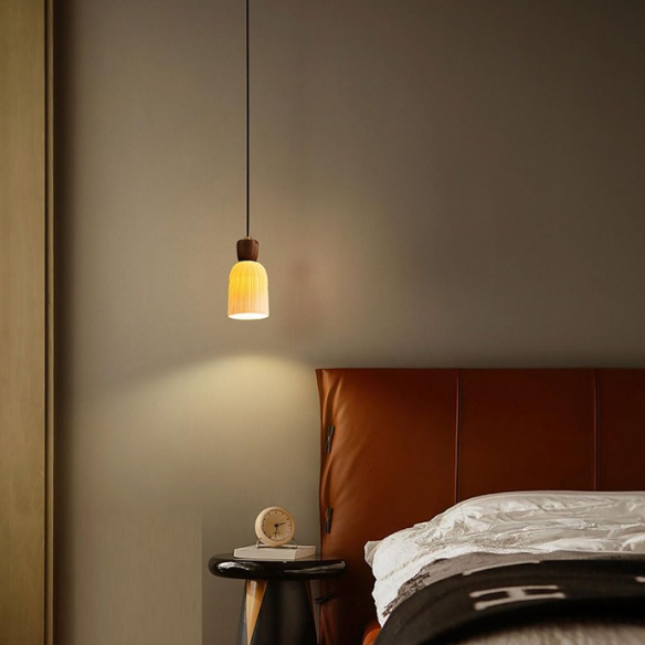 Modern adjustable black pendant light with white ceramic shade, ideal for dining room and kitchen island.