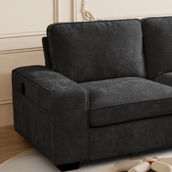 Modern black chenille upholstered sofa with reversible cushions, built-in USB charging port, under-seat storage, and matching ottoman and toss pillows.