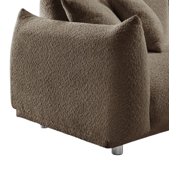 Modern camel upholstered sofa with deep seating and chrome-finished legs, featuring 4 matching accent pillows, ideal for stylish living rooms.
