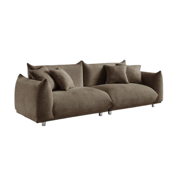 Modern camel upholstered sofa with deep seating and chrome-finished legs, featuring 4 matching accent pillows, ideal for stylish living rooms.