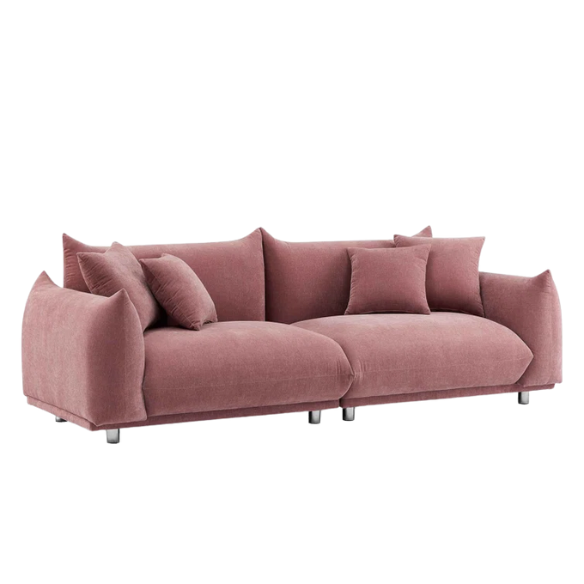 Modern dusty rose upholstered sofa with deep seating and chrome-finished legs, featuring four matching accent pillows—ideal for soft, stylish living spaces.