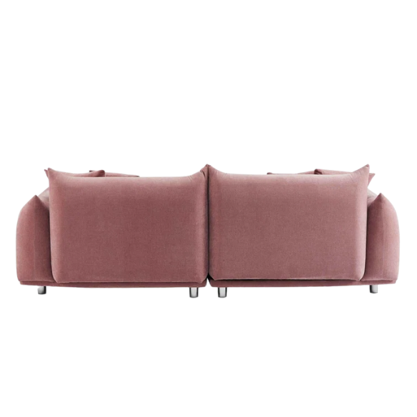 Modern dusty rose upholstered sofa with deep seating and chrome-finished legs, featuring four matching accent pillows—ideal for soft, stylish living spaces.
