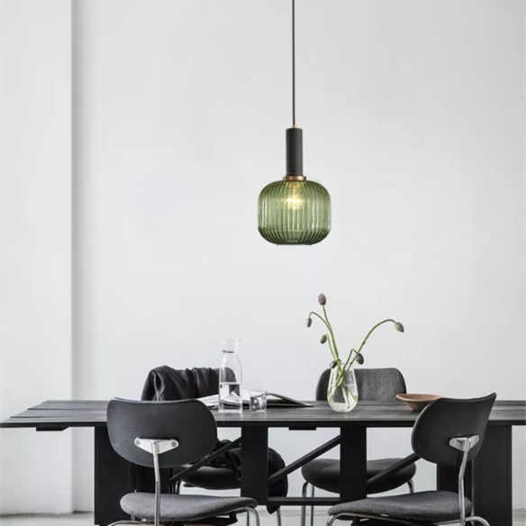 Modern green glass pendant light with black finishes, ideal for kitchen island, dining room, and living spaces. Stylish ceiling fixture with adjustable cord, energy-efficient LED compatible, and UL listed.