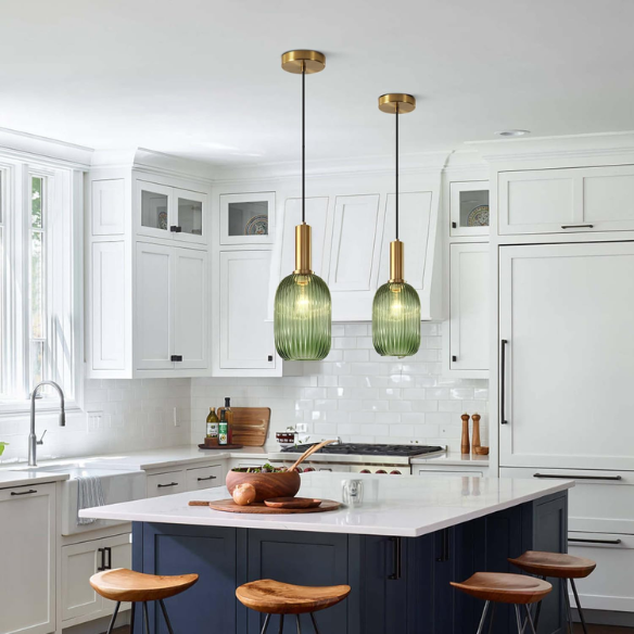 Modern green glass pendant light with gold finish, perfect for contemporary interiors.