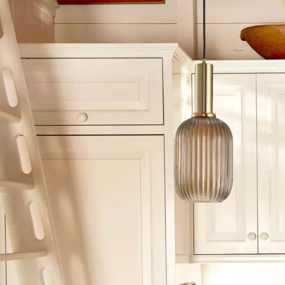 Modern grey glass pendant light with gold finish, ideal for contemporary and industrial interiors.