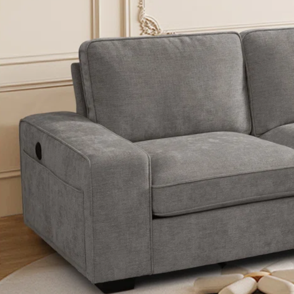 Modern light grey chenille upholstered sofa with reversible cushions, under-seat storage, built-in USB charging port, and matching ottoman and accent pillows.