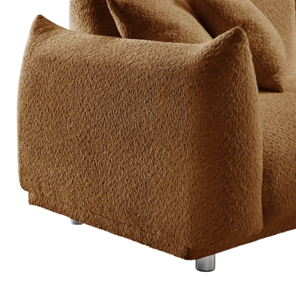 Modern rust brown upholstered sofa with deep seating and chrome-finished legs, featuring 4 matching accent pillows for a warm, stylish living room.