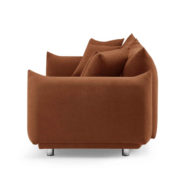 Modern rust upholstered sofa with deep seating and chrome-finished legs, featuring 4 matching accent pillows, perfect for contemporary living rooms.