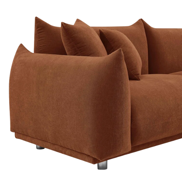 Modern rust upholstered sofa with deep seating and chrome-finished legs, featuring 4 matching accent pillows, perfect for contemporary living rooms.