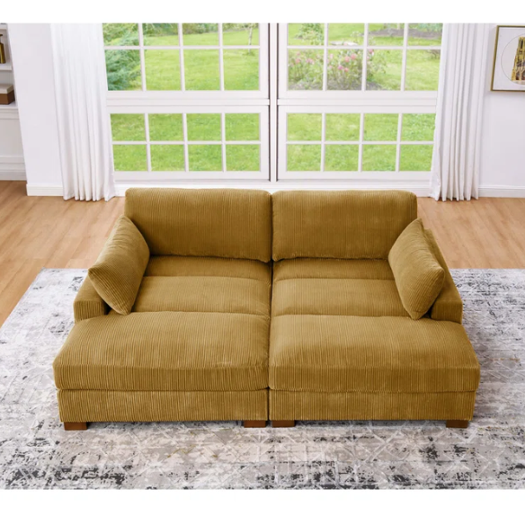 Mustard yellow corduroy convertible sleeper sofa with adjustable headrest, twin bed functionality, and mid-century wood legs