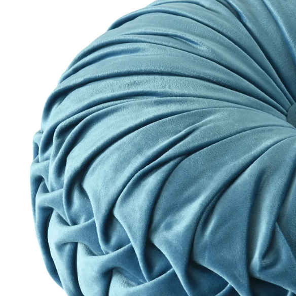Muted blue velvet round throw pillows with pleated detailing and button center, 14.5-inch set of two styled on a neutral-toned sofa.