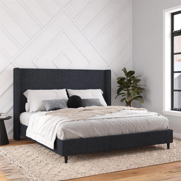 Navy blue canvas upholstered king platform bed with tall wingback headboard, no box spring required