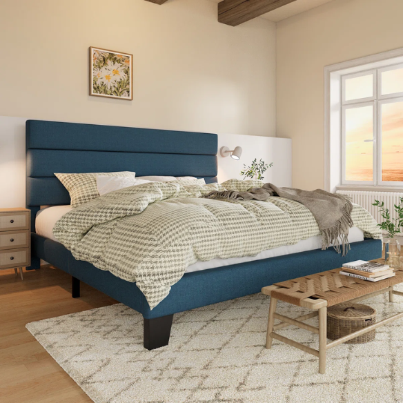 Navy blue king-size upholstered platform bed with rectangular headboard, padded linen-blend fabric, and slat support system