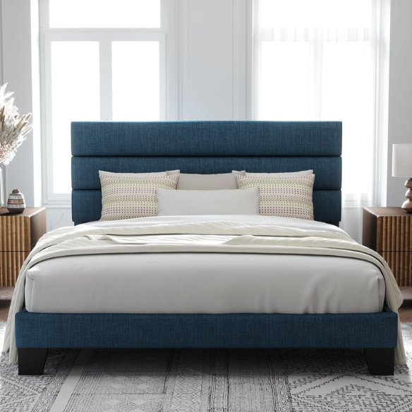 Navy blue king-size upholstered platform bed with rectangular headboard, padded linen-blend fabric, and slat support system
