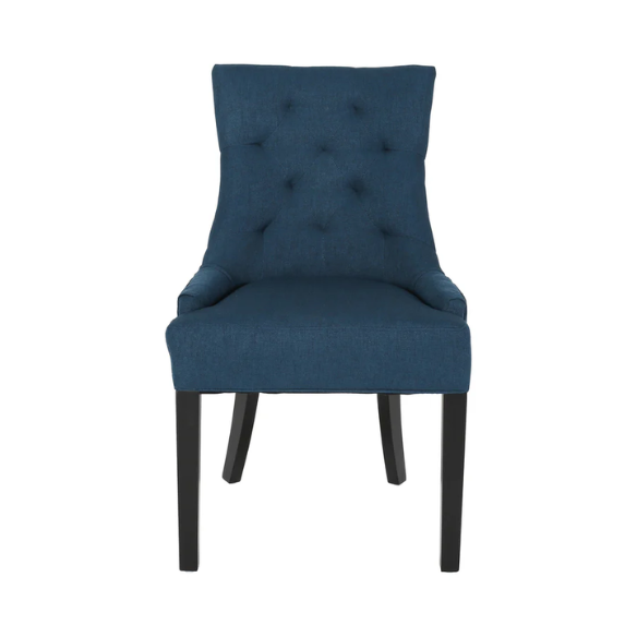 Set of four navy blue upholstered dining chairs featuring diamond tufted backs, armless design, sloped sides, and espresso brown wooden legs.