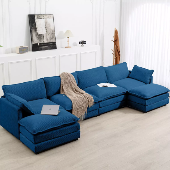 Navy blue 4-seat modular sectional sofa with two matching ottomans, upholstered in plush corduroy with durable wood and metal frame and high-density sponge cushions.