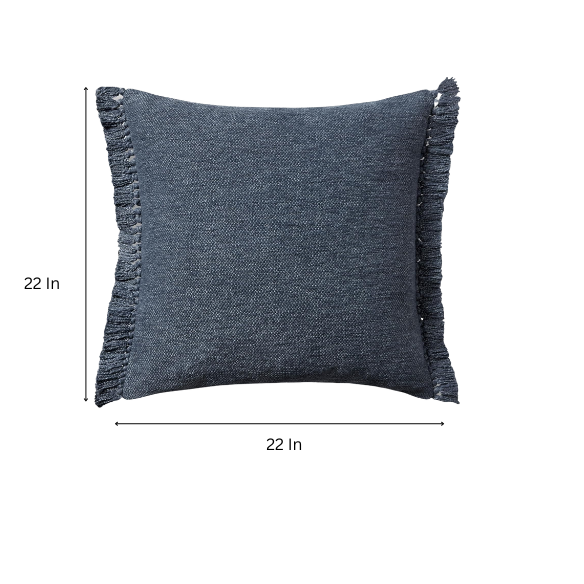 Navy cotton blend throw pillow with fringe, 22x22 square decorative cushion styled on a neutral sofa for bold, modern interior decor.