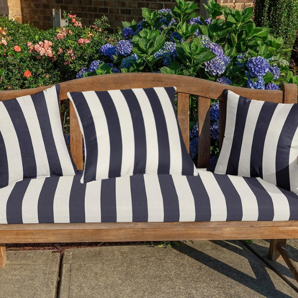 Navy blue and white striped accent pillow – reversible, weather-resistant, and overstuffed with polyester fill; perfect for indoor and outdoor use on patios, porches, or sofas.
