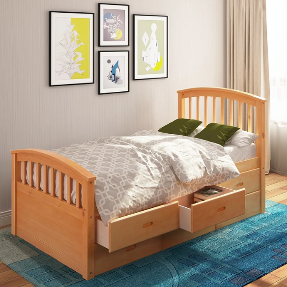 Oak twin bed frame made of solid pine wood with underbed storage drawers, eco-friendly finish, and slatted base, ideal for children or teens in a rustic or modern bedroom.