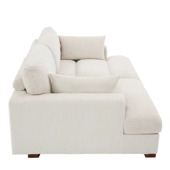 Off-white corduroy convertible sleeper sofa with adjustable headrest, twin bed functionality, and mid-century wooden legs