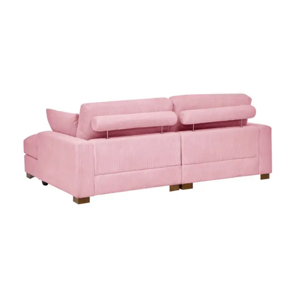 Pink corduroy convertible sleeper sofa with adjustable headrest, twin bed functionality, and mid-century wood legs